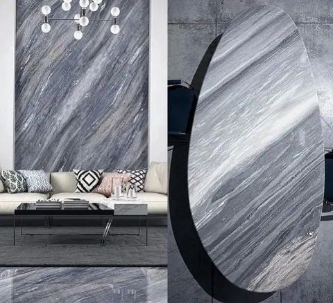Stone with flowing linear bands is used for the feature wall, alongside comfortable seating and a restrained neutral palette.